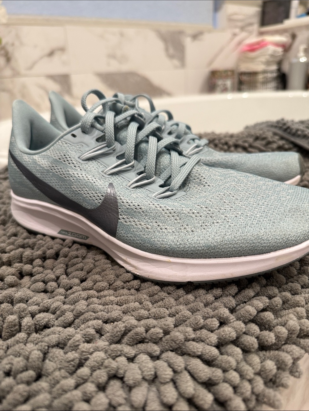 Nike Women's Light Blue Mesh Running Shoes with Gray Swoosh